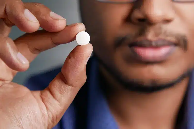 Man Holding Pill 178545694 L 800